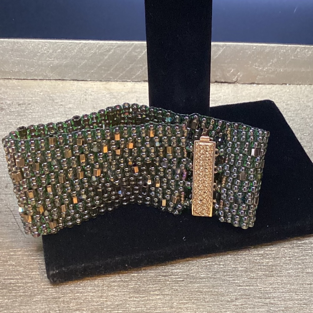 Hand beaded bracelet deep mossy green, bronze,and purple tone beads. Sparkle!